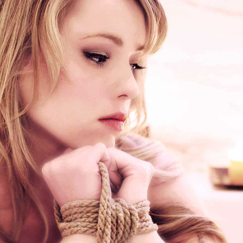 Sexual Massage - Couple kisses intensely as the women runs her hands across her partners body